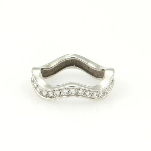 CARTIER DIAMOND GOLD WAVE BAND 18K WHITE HALF CHANNEL SET 4.75: CARTIER DIAMOND GOLD WAVE BAND 18K WHITE HALF CHANNEL SET 4.75 The elegant Cartier Wave Band is a stunning piece of fine jewelry featuring a channel-set sparkling white diamonds across the front of th