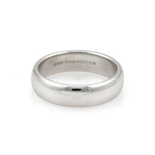 TIFFANY & CO. RING PLATINUM 6MM WIDE DOME BAND SIZE 9.5: TIFFANY & CO. RING PLATINUM 6MM WIDE DOME BAND SIZE 9.5 The product is a Tiffany & Co. platinum ring with a 6mm wide dome band, designed in a size 9.5. Made in the United States, this ring features a 