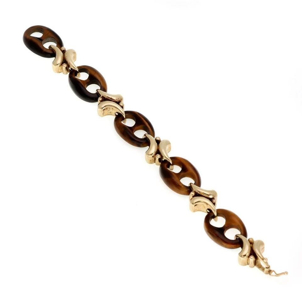VINTAGE 14K YELLOW GOLD TIGER'S EYE MARINER LINK FANCY BRACELET: VINTAGE 14K YELLOW GOLD TIGER'S EYE MARINER LINK FANCY BRACELET Vintage 14k Yellow Gold Tiger's Eye Mariner Link Fancy Bracelet Description This is a beautiful bracelet, it is crafted from 14k yellow 