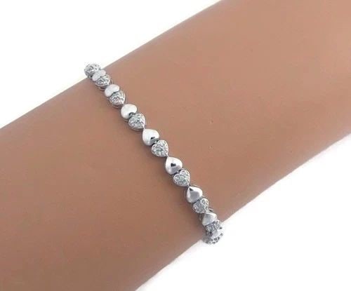DIAMOND GOLD BRACELET 18K WHITE DOUBLE HEART LINK BRACELET 7" LONG: DIAMOND GOLD BRACELET 18K WHITE DOUBLE HEART LINK BRACELET 7" LONG This Diamond Gold Bracelet features a charming design with a double heart link and pavé setting style, making it a stylish and elega