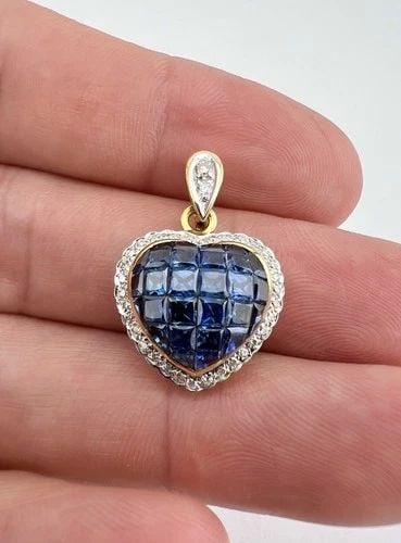 18K YELLOW GOLD INVISIBLE SET PRINCESS CUT SAPPHIRE & DIAMOND HEART HALO PENDANT: 18K YELLOW GOLD INVISIBLE SET PRINCESS CUT SAPPHIRE & DIAMOND HEART HALO PENDANT 18K Yellow Gold Invisible Set Princess Cut Sapphire & Diamond Heart Halo Pendant Size: 1" (25mm) Tall With Bail By Arou