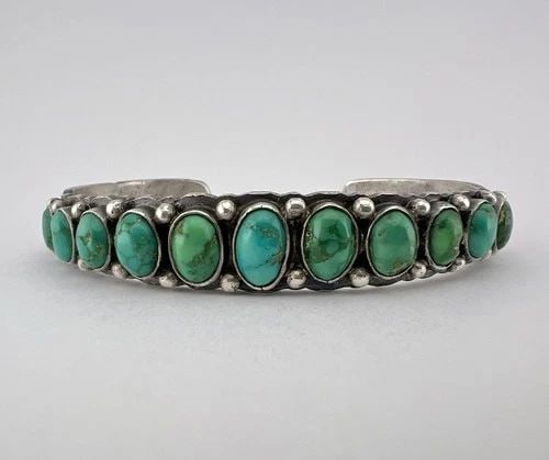 OLD 1930S NAVAJO COIN SILVER INGOT CERRILLOS TURQUOISE STAMPED CUFF BRACELET 34G: OLD 1930s Navajo Coin Silver Ingot Cerrillos Turquoise Stamped Cuff Bracelet 34g Cuff is Just Under 5 3/4" tip to Tip and has a 1 1/8" Wide Gap Cuff Is 1/2" Wide In the Center Weight is 34.0 Grams on 