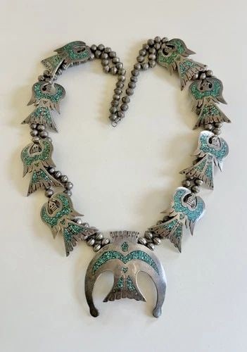 238.3G NAVAJO STERLING SILVER CHIP TURQUOISE PEYOTE BIRD SQUASH BLOSSOM NECKLACE: Vtg 238.3g Navajo Sterling Silver Chip Turquoise Peyote Bird Squash Blossom Necklace 30.5" This Amazing necklace features huge specimens of Natural Chip Flush Inlay Turquoise. Necklace has Over 8mm Wi
