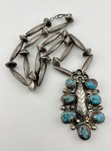 VINTAGE NAVAJO STERLING SILVER LAVENDER PIT BISBEE TURQUOISE BENCH BEAD NECKLACE: Vintage Navajo Sterling Silver Lavender Pit Bisbee Turquoise Bench Bead Necklace MEASUREMENTS: Necklace measures 22 3/4" Tip To Tip Pendant is Just Under 3" Tall by 1 3/4" Wide Saucer Bench Bead Pearl