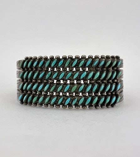 OLD 1940S ZUNI STERLING SILVER NEEDLEPOINT TURQUOISE 4 ROW STAMPED CUFF BRACELET: OLD 1940s Zuni Sterling Silver Needlepoint Turquoise 4 Row Stamped Cuff Bracelet Cuff is Slightly Over 5" tip to Tip and has a 1 1/8" Wide - Adjustable Gap Cuff Is 1" Wide In The Center Weight is 34.5