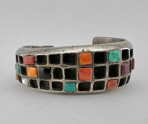 RARE 116G UNUSUAL NAVAJO SANDCAST STERLING SILVER MULTI GEMSTONE CUFF BRACELET: RARE 116G UNUSUAL NAVAJO SANDCAST STERLING SILVER MULTI GEMSTONE CUFF BRACELET Rare 116g Unusual Navajo Sandcast Sterling Silver Multi Gemstone Cuff Bracelet Cuff is 4 1/2" tip to Tip and has a 1 1/2"