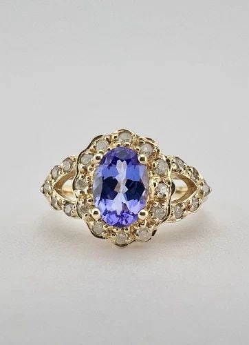DESIGNER 14K YELLOW GOLD .72CT OVAL TANZANITE & PAVE SET .28CT DIAMOND HALO RING: DESIGNER 14K YELLOW GOLD .72CT OVAL TANZANITE & PAVE SET .28CT DIAMOND HALO RING Designer 14k Yellow Gold .72ct Oval Tanzanite & Pave Set .28ct Diamond Halo Ring Ring Size: 7 - Can Be Resized Weight i