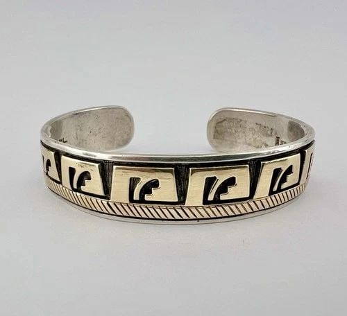 VTG MIKE BEGAY NAVAJO STERLING SILVER & 14K GOLD STAMPED OVERLAY CUFF BRACELET: VTG MIKE BEGAY NAVAJO STERLING SILVER & 14K GOLD STAMPED OVERLAY CUFF BRACELET Vtg Mike Begay Navajo Sterling Silver & 14k Gold Stamped Overlay Cuff Bracelet Cuff is Around 5 5/8" Tip to Tip and has a