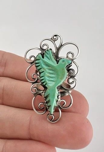 VINTAGE NAVAJO STERLING SILVER CARVED TURQUOISE FLYING EAGLE / BIRD WOMEN'S RING: Vintage Navajo Sterling Silver Carved Turquoise Flying Eagle / Bird Women's Ring Ring Size: 6.75 - Can Be Resized Weight is 10.4 Grams on my scale Metal: Sterling Silver Ring is 1 5/8" Tall In the Cen