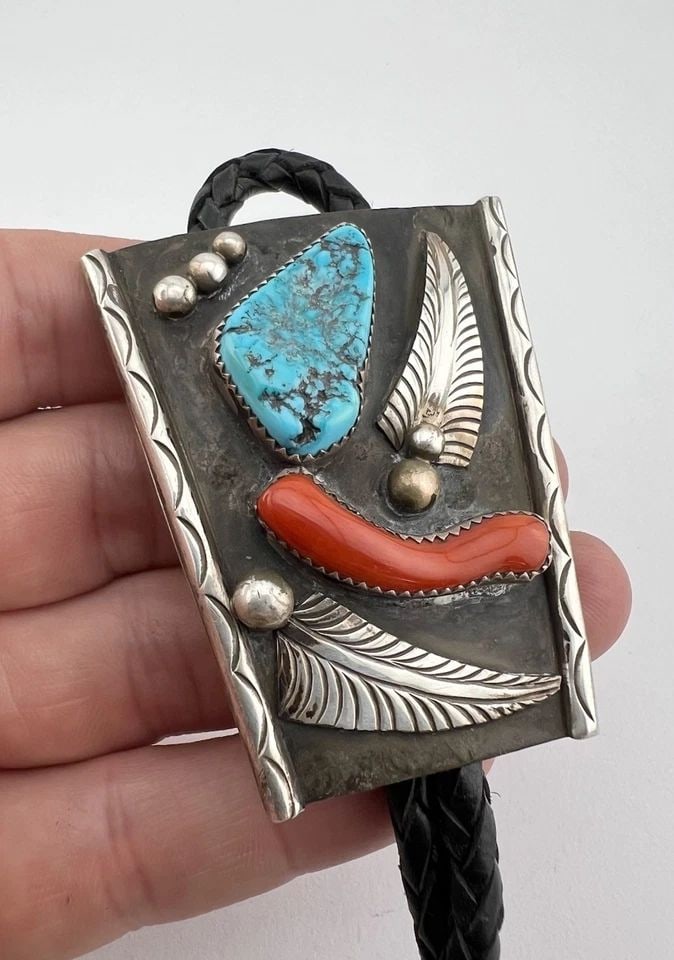GIBSON MONTANO NAVAJO STERLING SILVER KINGMAN TURQUOISE & CORAL BOLO TIE 2.25": Vintage Gibson Montano Navajo Sterling Silver Kingman Turquoise & Coral Bolo Tie 2.25" Size: 2 1/4" Tall by 2" Wide At The Top Weight is 44.4 Grams on my scale Metal: Sterling Silver Amazing Natural B