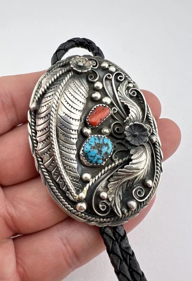 VTG NAVAJO STERLING SILVER NATURAL TURQUOISE & RED CORAL STAMPED BOLO TIE 2.5": VTG NAVAJO STERLING SILVER NATURAL TURQUOISE & RED CORAL STAMPED BOLO TIE 2.5" Vtg Navajo Sterling Silver Natural Turquoise & Red Coral Stamped Bolo Tie 2.5" Size: 2 1/2" Tall by 1 7/8" Wide Weight is