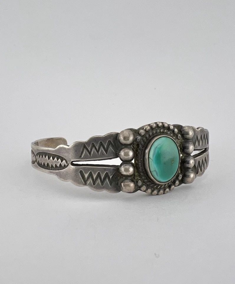 VTG FRED HARVEY NAVAJO STERLING SILVER CERRILLOS TURQUOISE STAMPED CUFF BRACELET: Vtg Fred Harvey Navajo Sterling Silver Cerrillos Turquoise Stamped Cuff Bracelet Cuff is 5 1/2" tip to Tip and has a 1 1/8" Wide Adjustable Gap Cuff Is 3/4" Wide In the Center Weight is 20.0 Grams on 