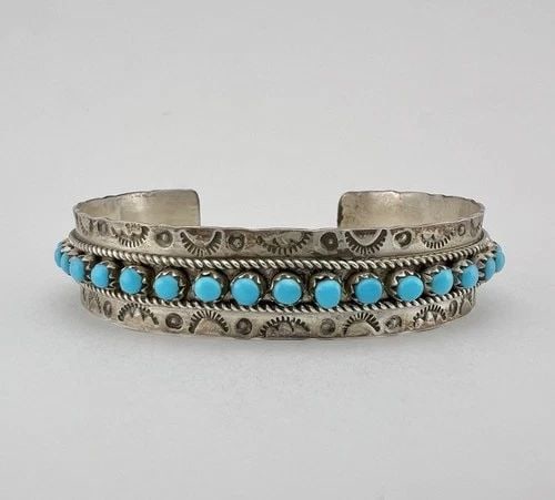 JASON & PEARL UKESTINE ZUNI STERLING SILVER SNAKE EYE TURQUOISE CUFF BRACELET: Vintage Jason & Pearl Ukestine Zuni Sterling Silver Snake Eye Turquoise Cuff Bracelet Cuff is 5 1/4" tip to Tip and has a 1" Wide Slightly Adjustable Gap Cuff Is Over 1/2" Wide Weight is 17.5 Grams on