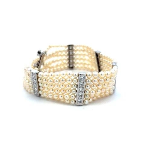 3–3.5MM PEARL BRACELET WITH 0.90CT H VS DIAMONDS IN 14K WHITE GOLD: 3–3.5MM PEARL BRACELET WITH 0.90CT H VS DIAMONDS IN 14K WHITE GOLD Title: This elegant 14K white gold bead bracelet features 258 lustrous 3–3.5 mm pearls arranged in six uniform rows, creating a s