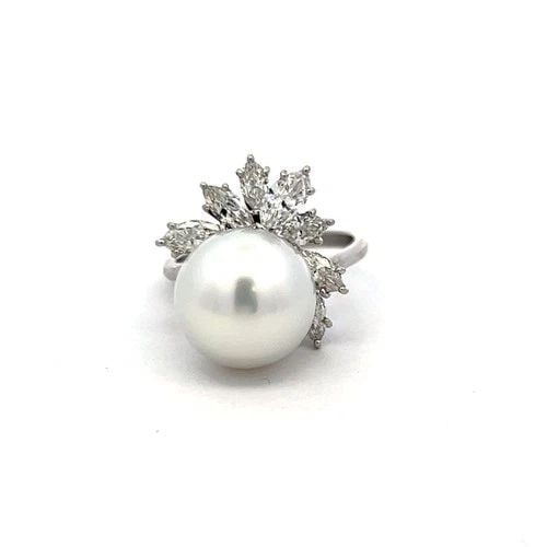PLATINUM COCKTAIL RING WITH 1.4 CARAT MARQUIS DIAMONDS & 12.1-12.7 MM PEARL: PLATINUM COCKTAIL RING WITH 1.4 CARAT MARQUIS DIAMONDS & 12.1-12.7 MM PEARL Video: Video Link Detailed Description: In the gentle embrace of platinum, a lustrous pearl, measuring 12.1-12.7mm, radiates
