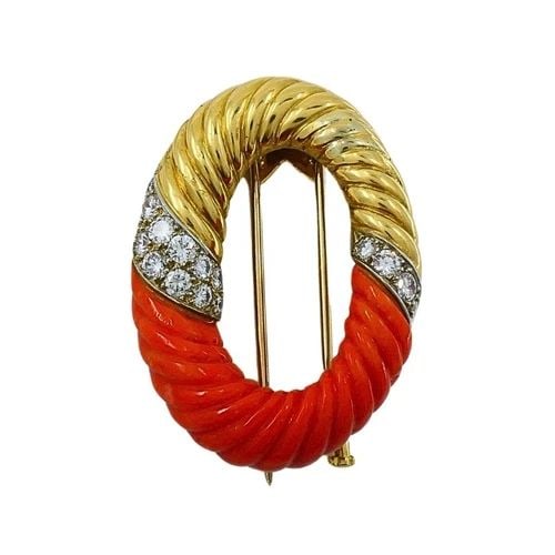 BVLGARI BULGARI 18K GOLD CORAL DIAMOND OVAL BROOCH: BVLGARI BULGARI 18K GOLD CORAL DIAMOND OVAL BROOCH DESIGNER: Bulgari CIRCA: 1970s MATERIALS: 18k Gold GEMSTONE: Diamond, Coral WEIGHT: 18.3 Grams MEASUREMENTS: 1 1/8" x 1 1/2" HALLMARKS: BVLGARI, Fren