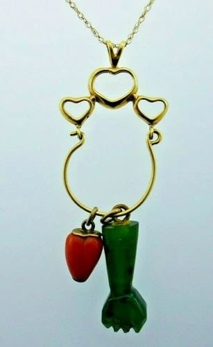 VINTAGE 14K YELLOW GOLD, CORAL & JADE FIGA & HEART MOTIF NECKLACE: VINTAGE 14K YELLOW GOLD, CORAL & JADE FIGA & HEART MOTIF NECKLACE 14k Yellow Gold, Coral & Jade Heart & Figa Motif Necklace This is a must for a collector. The weight is 6.6 grams. The length of chain