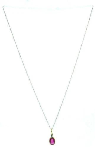 14K YELLOW GOLD SYNTHETIC RUBY WHITE GOLD CHAIN NECKLACE: 14K YELLOW GOLD SYNTHETIC RUBY WHITE GOLD CHAIN NECKLACE 14k white gold chain necklace with a 14k yellow gold synthetic ruby Measurements: the chain is 1/16" W x 17" L; the pendant is 1/4" W x 3/4" L 