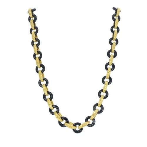 VINTAGE TIFFANY & CO. 18K GOLD ONYX NECKLACE: VINTAGE TIFFANY & CO. 18K GOLD ONYX NECKLACE KL JEOOO This Tiffany & Co. onyx and 18k gold necklace reflects the bold, sculptural aesthetic the house favored in the late 1970s through the mid-1980s. A