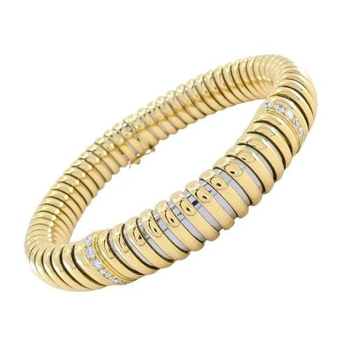 VINTAGE CARTIER 18K GOLD & STAINLESS STEEL TUBOGAS DIAMOND BRACELET: VINTAGE CARTIER 18K GOLD & STAINLESS STEEL TUBOGAS DIAMOND BRACELET DESIGNER: Cartier CIRCA: 1980s MATERIALS: 18K Gold & Stainless Steel GEMSTONE: Diamond WEIGHT: 24.8 Grams MEASUREMENTS: 3/8" × 7&fr