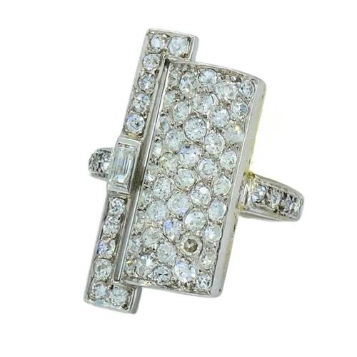ART DECO RING PLATINUM OLD EUROPEAN CUT DIAMOND FRENCH ESTATE JEWELRY: Art Deco French Diamond Platinum Ring A spectacular French Art Deco diamond ring made of platinum and 18k white gold. The center of the ring features a slightly curved platinum panel adorned with a da