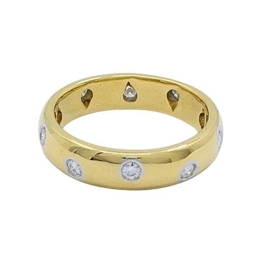 TIFFANY & CO. 18K GOLD & PLATINUM ACCENT DIAMOND BAND RING: TIFFANY & CO. 18K GOLD & PLATINUM ACCENT DIAMOND BAND RING DESIGNER Tiffany & Co. CIRCA 1990s MATERIALS 18k Gold, Platinum 950 GEMSTONE Diamond WEIGHT 5.5 Grams MEASUREMENTS 3/16" RING SIZE 5.5 HALLMA