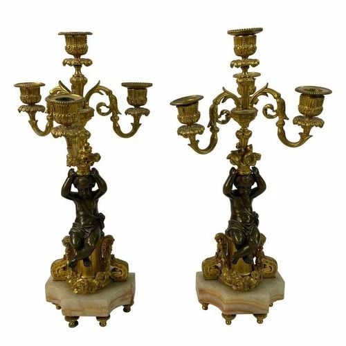 VICTORIAN BRONZE CHEROB PAIR OF CANDLESTICKS: VICTORIAN BRONZE CHEROB PAIR OF CANDLESTICKS VICTORIAN BRONZE CHEROB PAIR OF CANDLESTICKS The candlesticks are made out of bronze with onyx base and gold brass details, featuring carobs and floral, le