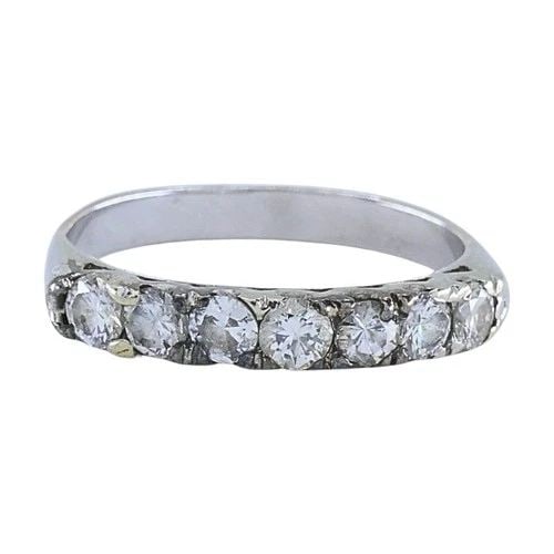 VINTAGE 12K GOLD DIAMOND RING SEVEN-STONE BAND: VINTAGE 12K GOLD DIAMOND RING SEVEN-STONE BAND ES JOOO Product details: CIRCA: Mid-20th Century MATERIALS: 12K Gold GEMSTONE: Diamond WEIGHT: 1.7 Grams RING SIZE: 5.25 ITEM DETAILS: Vintage 12k Gold D