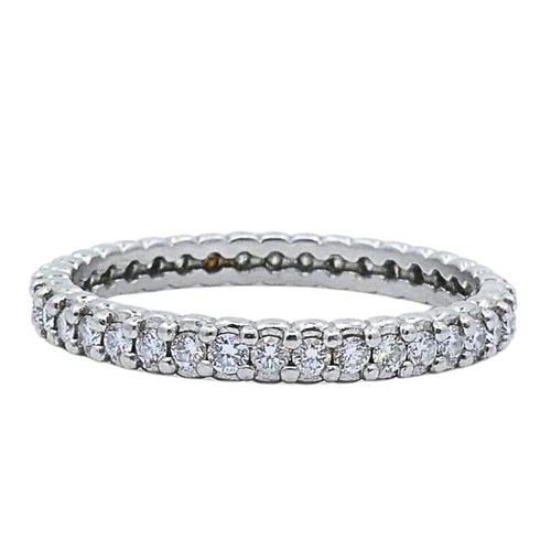MORELLI PLATINUM PINPOINT DIAMOND ETERNITY RING: MORELLI PLATINUM PINPOINT DIAMOND ETERNITY RING Product details: DESIGNER: Paul Morelli CIRCA: Late 20th Century MATERIALS: Platinum GEMSTONE: Diamond WEIGHT: 2.5 Grams MEASUREMENTS: 1/8" Width RING S