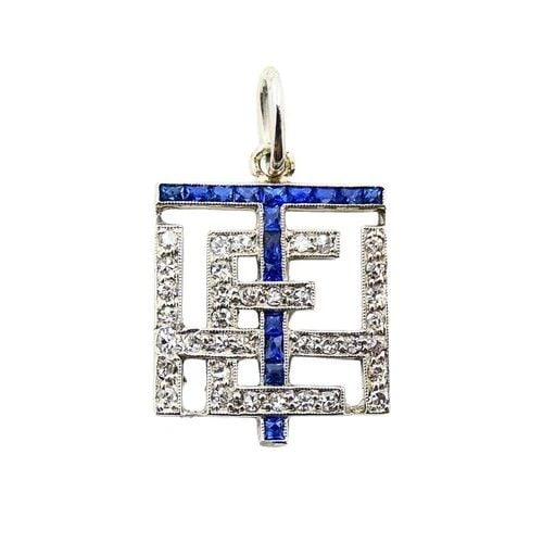 ANTIQUE PLATINUM DIAMOND SAPPHIRE GEOMETRIC PENDANT CHARM: ANTIQUE PLATINUM DIAMOND SAPPHIRE GEOMETRIC PENDANT CHARM MATERIALS: Platinum GEMSTONE: Diamond, Sapphire WEIGHT: 1.7 Grams MEASUREMENTS: 1/2" x 1/2" ITEM DETAILS: Antique Platinum Diamond Sapphire Ge