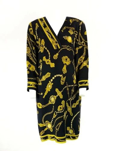 VINTAGE LEONARD BLACK AND YELLOW V- NECK MINI DRESS: VINTAGE LEONARD BLACK AND YELLOW V- NECK MINI DRESS VINTAGE LEONARD BLACK AND YELLOW V- NECK MINI DRESS 100% Silk Black with yellow chain print and LEONARD stamps V- neck, measures 9 inches long 3 lar