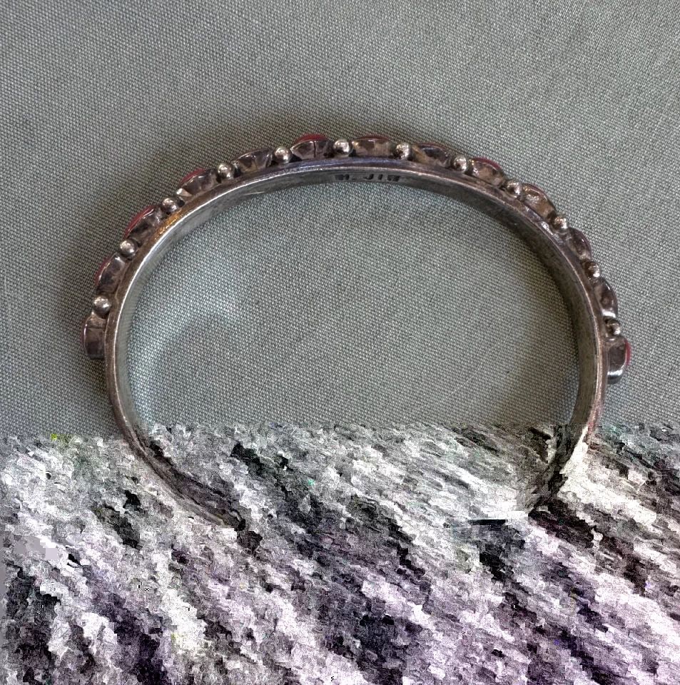 HARRISON JIM - VINTAGE NAVAJO STERLING SILVER CORAL ROW BRACELET - SZ 6 1/4": HARRISON JIM - VINTAGE NAVAJO STERLING SILVER CORAL ROW BRACELET - SZ 6 1/4" This vintage bracelet has been beautifully crafted by Navajo silversmith Harrison Jim. The bracelet measures 5 1/4" around 