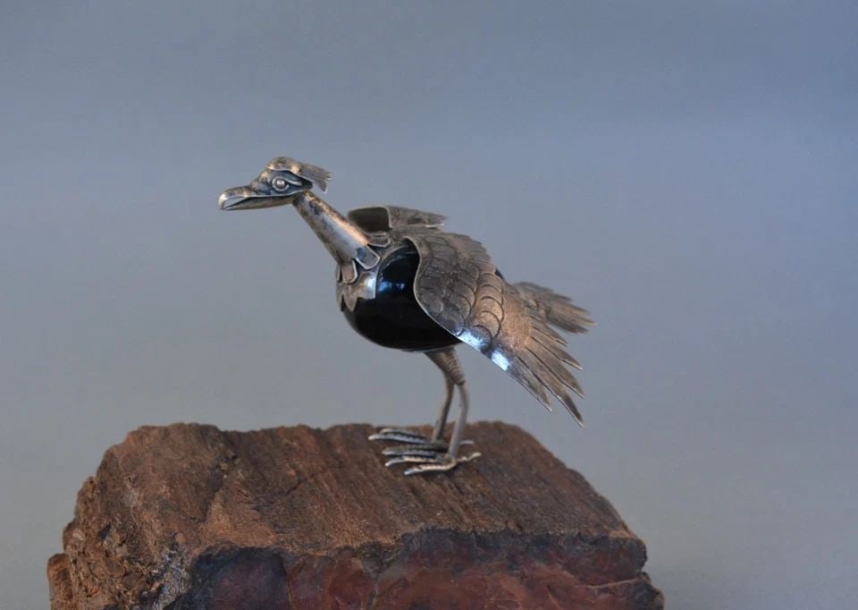 VINTAGE TAXCO MEXICO STERLING SILVER EXOTIC ONYX BIRD FIGURINE - 1940S-50S: This vintage sterling silver with black onyx bird figurine was made in Taxco, Mexico and dates to the 1940s-50s. The makers mark has been mostly worn away. The bird stands approximately 3" high and 3 