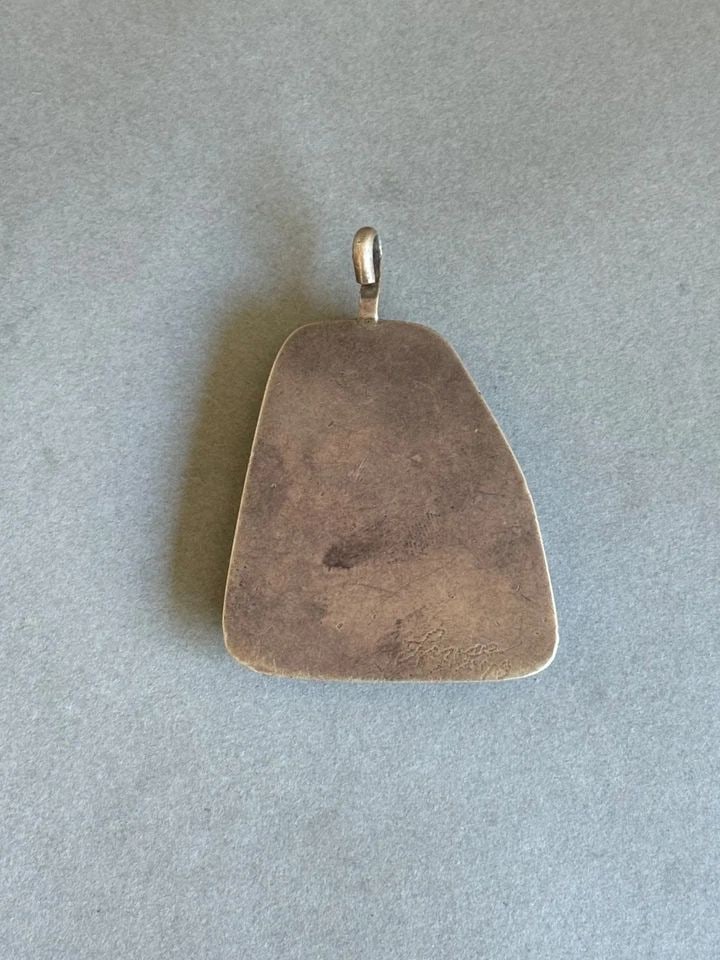 OLD PAWN NAVAJO STERLING SILVER WITH MALACHITE AND BONE PENDANT: OLD PAWN NAVAJO STERLING SILVER WITH MALACHITE AND BONE PENDANT Old Pawn Navajo Sterling Silver with Malachite and Bone Pendant ..2 1/4" Tall 1 5/8" wide .. 31 Grams