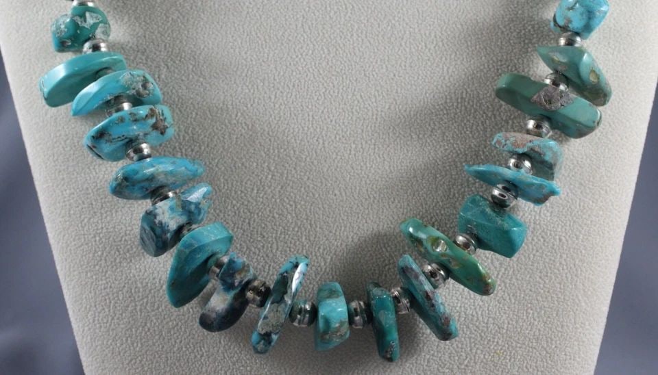 OLD PAWN NAVAJO TURQUOISE AND SILVER NECKLACE: OLD PAWN NAVAJO TURQUOISE AND SILVER NECKLACE Item Description: 21 1/2 " Long Turquoise is 1/2 " to 1 1/8 " Sterling Tips and Beads..