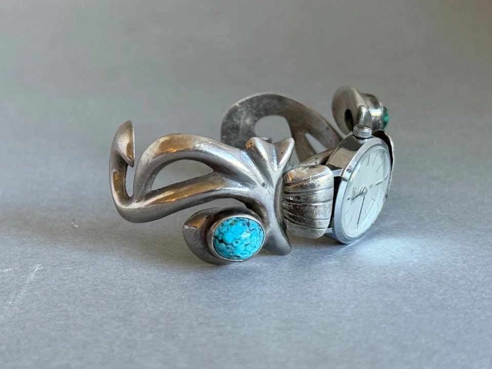 VINTAGE NAVAJO STERLING SILVER CAST WATCH BRACELET WITH TURQUOISE.: VINTAGE NAVAJO STERLING SILVER CAST WATCH BRACELET WITH TURQUOISE. Vintage Navajo Sterling Silver Cast Watch Bracelet with Turquoise. 1" Wide .. 4 1/2" Inside with a 1 3/8" Opening ..1.5oz ..