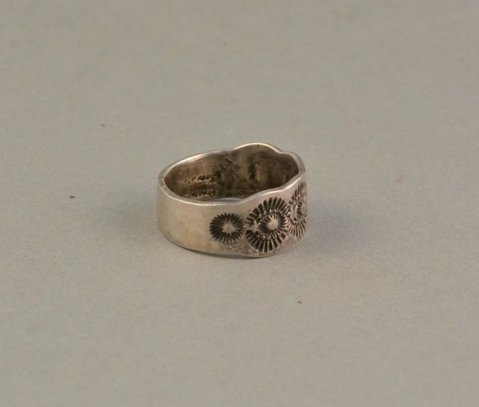 MARC ANTIA APACHE STERLING SILVER HAND-STAMPED RING SIZE 11 3/4 SIGNED: MARC ANTIA APACHE STERLING SILVER HAND-STAMPED RING SIZE 11 3/4 SIGNED 7/16 " wide ..8.3 Grams Signed Marc Antia Throughout the 40 years that I have been in business, I have purchased jewelry from paw