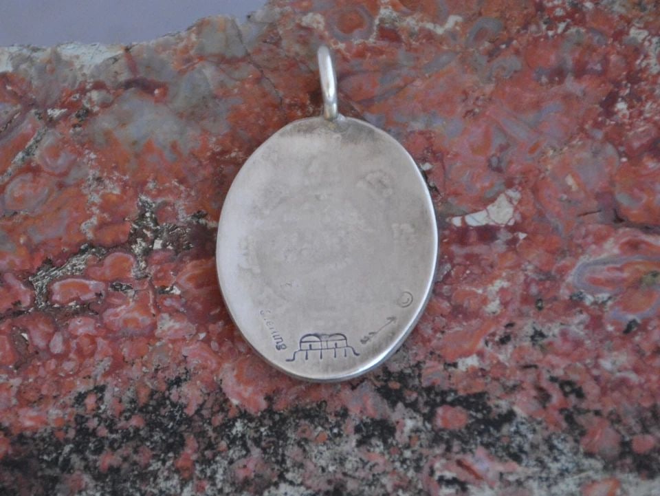 MANUEL HOYUNGOWA (1953-2011) - HOPI STERLING SILVER PENDANT - SUN FACE - 1.5": MANUEL HOYUNGOWA (1953-2011) - HOPI STERLING SILVER PENDANT - SUN FACE - 1.5" This sterling silver pendant has been beautifully crafted by the Hopi artists Manuel and Karen Hoyungwa. The pendant shows