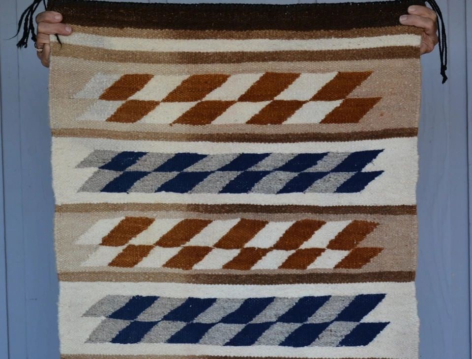 VINTAGE NAVAJO RUG - SLANTED CHECKERBOARD BANDED DESIGN - 31.5" X 24": VINTAGE NAVAJO RUG - SLANTED CHECKERBOARD BANDED DESIGN - 31.5" X 24" This vintage Navajo rug shows a banded design. This rug is in fair condition. It looks to be clean but has a little fade on both s