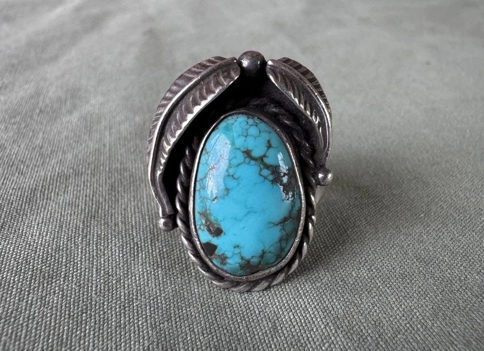 OLD PAWN STERLING SILVER AND TURQUOISE RING 6 3/4: OLD PAWN STERLING SILVER AND TURQUOISE RING 6 3/4 1" Tall .. 7.1 grams ..6 3/4 Ring Size Throughout the 40 years that I have been in business, I have purchased jewelry from pawn shops throughout the S