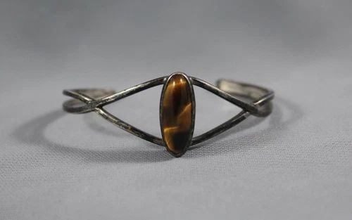 OLD PAWN NAVAJO STERLING SILVER WITH TIGERS EYE STONE BRACELET: OLD PAWN NAVAJO STERLING SILVER WITH TIGERS EYE STONE BRACELET Item Description: 1" Wide 5 1/2 " Inside with a 1 1/2 " Opening