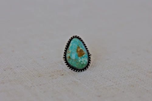 OLD PAWN NAVAJO STERLING SILVER AND TURQUOISE RING SIZE 6: OLD PAWN NAVAJO STERLING SILVER AND TURQUOISE RING SIZE 6 1 " Tall .5.5 Grams Throughout the 40 years that I have been in business, I have purchased jewelry from pawn shops throughout the Southwest th