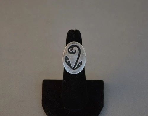 OLD PAWN HOPI STERLING ON STERLING SILVER RING - SEEDLING DESIGN - SIZE 5: OLD PAWN HOPI STERLING ON STERLING SILVER RING - SEEDLING DESIGN - SIZE 5 This vintage Hopi sterling silver shows a seedling design in silver on silver. The front of the ring is 1" tall and the ring i