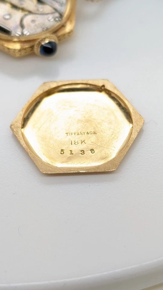 TIFFANY & CO. 18K & 14K GOLD 5138 MANUAL WINDING BRACELET WATCH 21MM SOLD AS IS: Vintage Tiffany & Co. 18K Yellow Gold Case & 14K Gold Bracelet Clasp Ref - 5138 Manual Winding Bracelet Watch Etched 'ZM' Case Size - 21mm Length - 6" Long Wrist Size - 5.5" Total Weight - 17.6 Grams 