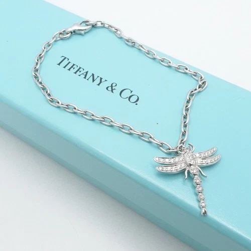 TIFFANY & CO. PLATINUM DRAGONFLY DIAMOND DANGLE CHARM BRACELET 7" LONG BOX: TIFFANY & CO. PLATINUM DRAGONFLY DIAMOND DANGLE CHARM BRACELET 7" LONG BOX Tiffany & Co. Platinum 950 Firefly Diamond Dangle Charm Bracelet Length - 7" Long Fits up to Relax 6.5 - 6.75" Snug Chain Wid