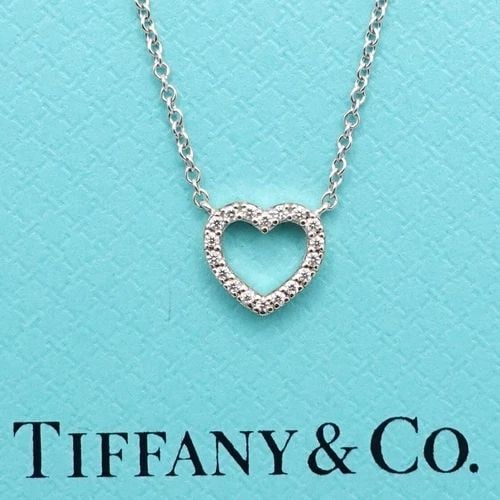 TIFFANY & CO. METRO 18K WHITE GOLD DIAMOND HEART MINI PENDANT NECKLACE 16" BOX: Tiffany & Co. Metro 18K White Gold Diamond Heart Mini Pendant Necklace Length - 16" Chain Width - 0.5mm approx. Dimension - 7.6mm x 8mm approx. Total Weight - 1.9 Grams Est. Retail Price - $2,150 USD 