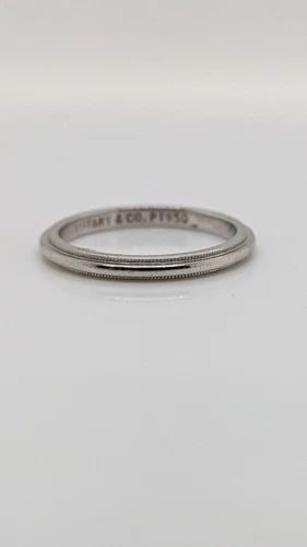 TIFFANY & CO. TOGETHER PLATINUM 2MM MILGRAIN WEDDING BAND RING SIZE 5.5: Tiffany & Co. Tiffany Together Platinum Milgrain Wedding Band Ring Ring Size - 5.5 Width - 2mm Weight - 3.3 Grams Professionally polished & Looks like New Pouch Not Included