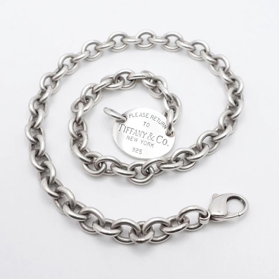 TIFFANY & CO. RETURN TO STERLING SILVER OVAL TAG CHOKER NECKLACE - 15.5": Tiffany & Co. Return To Sterling Silver Oval Tag Choker Necklace Length - 15.5" Chain Width - 8mm Tag Size - 0.85" x 0.7" Est. Retail - $900 USD Total Weight - 50.7 Grams Pouch NOT Included