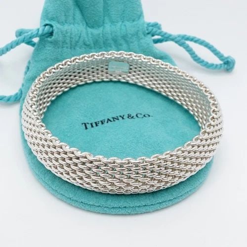 TIFFANY & CO. SOMERSET STERLING SILVER 15MM MESH BRACELET SIZE 7.75" WRIST POUCH: Tiffany & Co. Sterling Silver Somerset Flexible Mesh Bracelet Fits up to 7.75" Wrist Chain Width - 15mm Est. Retail Price - $825 USD Total Weight - 58.6 Grams Very Great & Professionally Polished Pouc