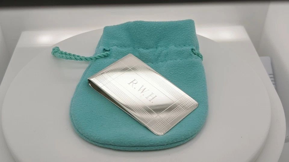 TIFFANY & CO. STERLING SILVER MONEY CLIP - 2.25" X 1.25" ETCHED: Tiffany & Co. Sterling Silver Money Clip Dimensions - 2.25" Long x 1.25" Wide Total Weight - 30.4 Grams Professionally Polished & Looks Like New Engraved On Front Pouch Included